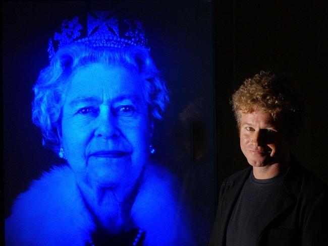 21/06/2004. Light artist Chris Levine is shown with his work, Equanimity, the first holographic portrait of Britain's Queen Elizabeth, at the Queen's Gallery at Buckingham Palace in London. The hologram, set in glass, mounted on granite and illuminated by a strip of blue LEDs, was to be unveiled at The Jersey Museum, St Helier later Tuesday June 22, 2004. (AP Photo/Fiona Hanson/PA) ** UNITED KINGDOM OUT MAGS OUT NO SALES **