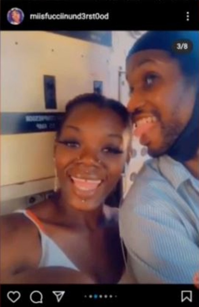 The couple in the cab of the subway train.