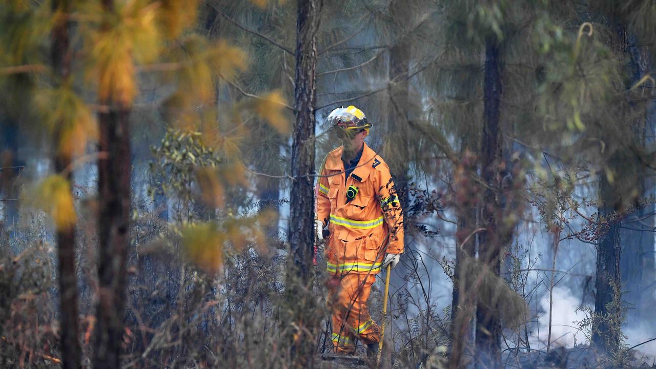 Firefighters monitor the blaze near Beerwah. Picture: Patrick Woods