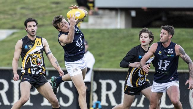 Launceston’s Zack Morris impresses his peers as he stretches to take a mark. Picture: Eddie Safarik
