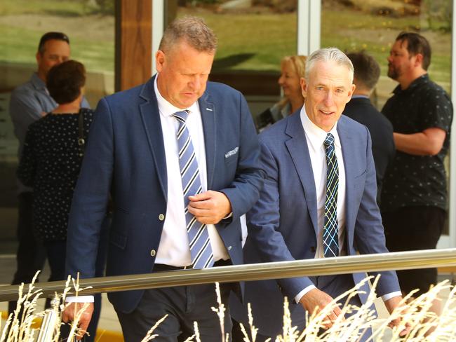 Former Victorian allrounder Jason Bakker and Test fast bowler Damien Fleming leave the funeral service for Ian Redpath. Picture: Alison Wynd