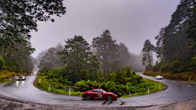 Victorian driver Michael Mansour and his Queensland navigator Paul Stuart drive through the Sideling in the 2020 Porsche Cayman. Picture: Other Side Productions Targa Tasmania 2022