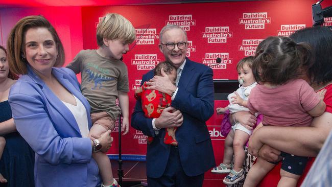 Aged Care Minister Anika Wells, with one of her twins, takes centre stage with Mr Albanese and three-month-old Maisie at Wednesday’s rally in Morningside. Picture: NewsWire/Glenn Campbell