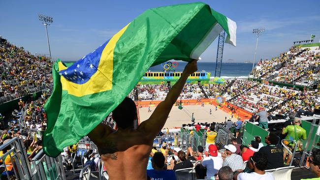 Brazilians partied hard on the first day flag of competition at the Beach Volleyball.