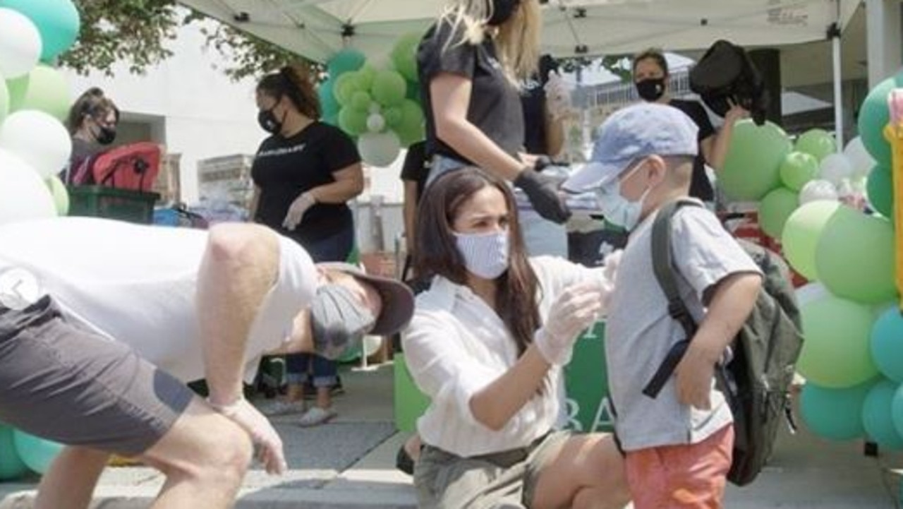 Meghan Markle and Prince Harry handing out school supplies in LA. Picture: Instagram