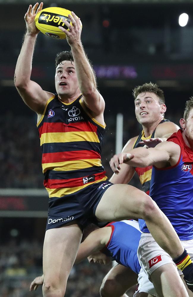 Adelaide’s Mitch McGovern marks against the Demons. Picture: Sarah Reed