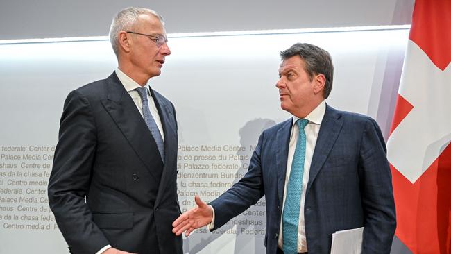 UBS Chairman Colm Kelleher (R) shakes hands to Credit Suisse chairman Axel Lehmann (L) after a press conference following talks over Credit Suisse in Bern. Picture: Fabrice COFFRINI / AFP