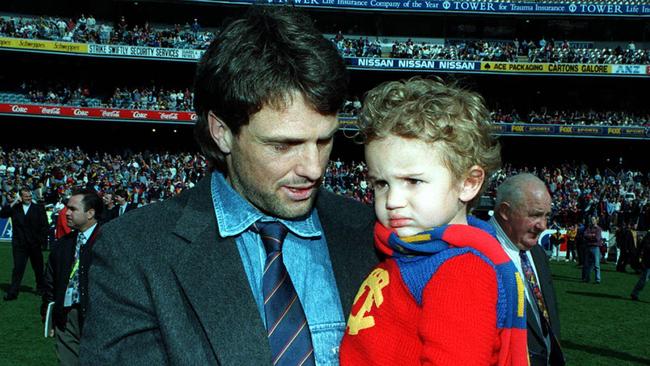 Sydney swans player & former Lion, Paul Roos & son at AFL match Richmond v Fitzroy, it was Lions last game in Victoria as they are merging with Brisbane Bears for 1997 season.  Australian Rules 1996Roos/Fam