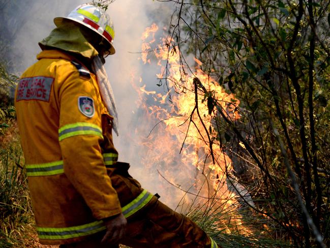 NSW Rural Fire Service crews from Terrey Hills and Duffy's Forest brigades conduct a hazard reduction along Mona Vale Road in St Ives. Picture: Jeremy Piper