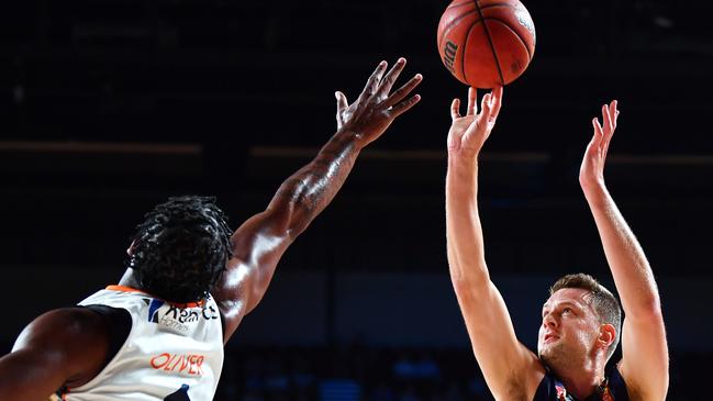 ADELAIDE, AUSTRALIA – FEBRUARY 08: Daniel Johnson of the 36ers shoots over Cameron Oliver of the Taipans during the match between the Adelaide 36ers and the Cairns Taipans at the Adelaide Entertainment Centre on February 08, 2020 in Adelaide, Australia. (Photo by Mark Brake/Getty Images)