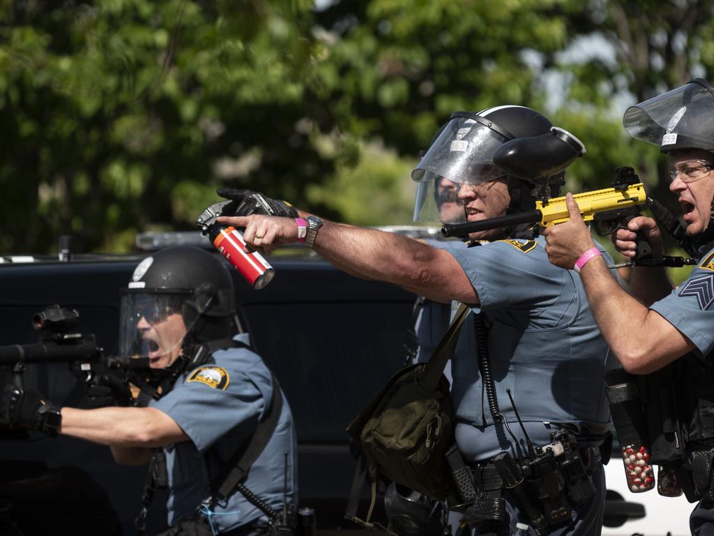 Police aim weapons at protesters after a third night of protests. Picture: Stephen Maturen/Getty Images/AFP.