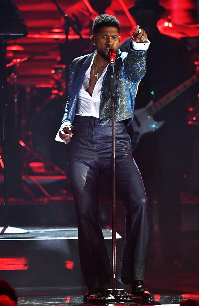 Usher led a tribute to Prince at the Grammys, including When Doves Cry and Kiss. Picture: Getty Images