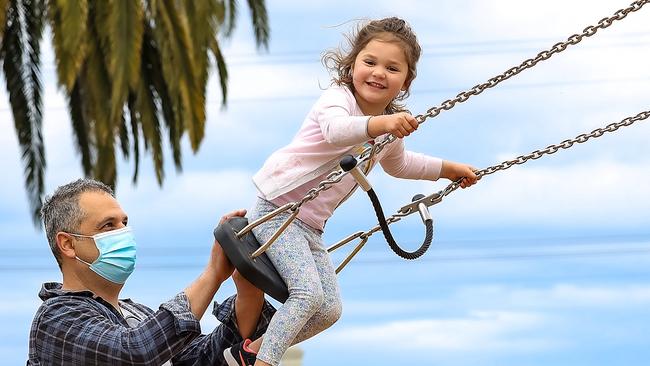 Four-year-old Sienna back on the swings at Dennis Reserve playground in Williamstown. Picture: Ian Currie