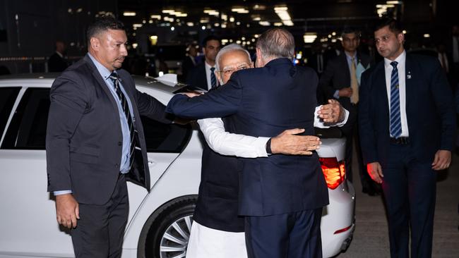 Anthony Albanese gave his Indian counterpart Narendra Modi a bear hug on arrival at the cultural event at Qudos Bank Arena in Sydney. Photo: Wolter Peeters