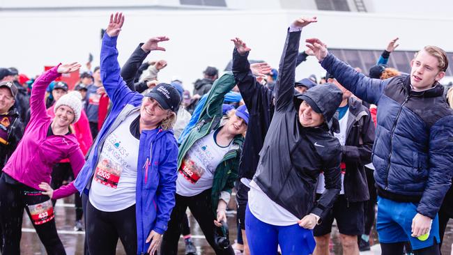 Warm up of the walking race at the start of the Point to pinnacle. Picture: Linda Higginson