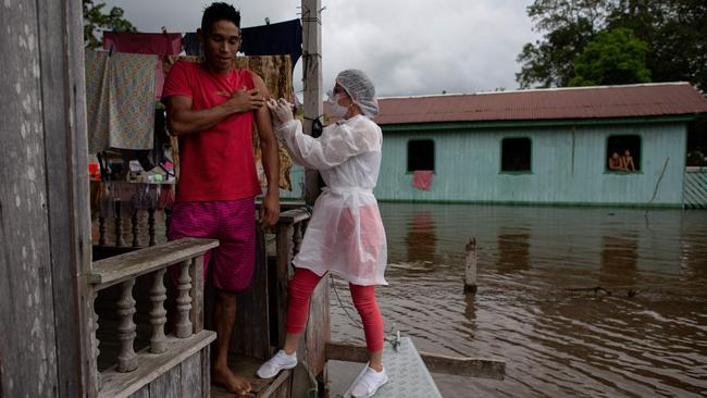 A resident is vaccinated against Covid-19 in Anama town, Amazon, Brazil. Picture: AFP