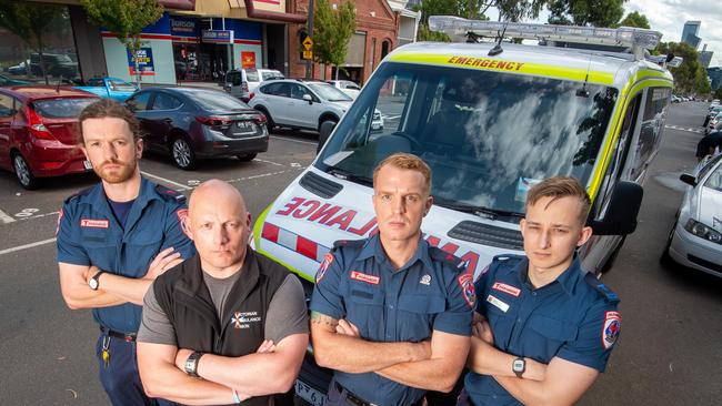 Paramedics, Patrick McNamara, Michael Toussaint and Lewis Hopkins with Victorian Ambulance Union General Secretart, Danny Hill. Picture: Jay Town