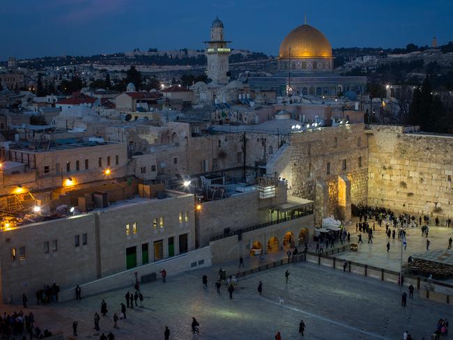 JERUSALEM, ISRAEL - JANUARY 12:  People pray at the Western Wall in the Old City on January 12, 2017 in Jerusalem, Israel. 70 countries attended the recent Paris Peace Summit and called on Israel and Palestinians to resume negotiations that would lead to a two-state solution, however the recent proposal by U.S President-elect Donald Trump to move the US embassy from Tel Aviv to Jerusalem and last month's U.N. Security Council resolution condemning Jewish settlement activity in the West Bank have contributed to continued uncertainty across the region. The ancient city of Jerusalem where Jews, Christians and Muslims have lived side by side for thousands of years and is home to the Al Aqsa Mosque compound or for Jews The Temple Mount, continues to be a focus as both Israelis and Palestinians claim the city as their capital. The Israeli-Palestinian conflict has continued since 1947 when Resolution 181 was passed by the United Nations, dividing Palestinian territories into Jewish and Arab states. The Israeli settlement program has continued to cause tension as new settlements continue to encroach on land within the Palestinian territories. The remaining Palestinian territory is made up of the West Bank and the Gaza strip.  (Photo by Chris McGrath/Getty Images)