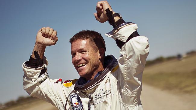 Baumgartner landed on his feet and fell to his knees, raising his arms in victory. Picture: Balazsgardi.com.