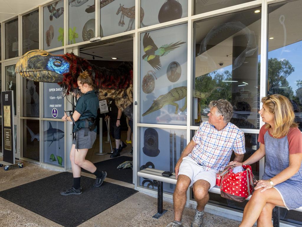 Puppeteer Rose Maher leads out a prehistoric life-size thunderbird puppet out of MAGNT, leaving tourists bemused. Picture: Floss Adams.