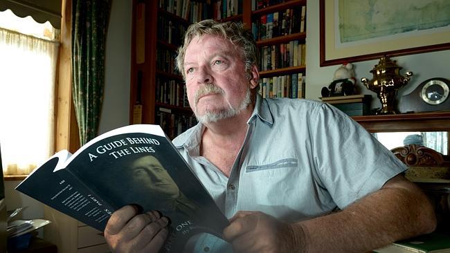 Retired Magistrate Richard Kleinig withone of his books cataloguing service personnel fro