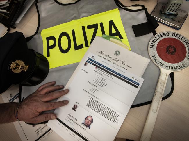 Italian police officers control Philip Jepson Egglishaw's file released by Interpol. Picture: Supplied