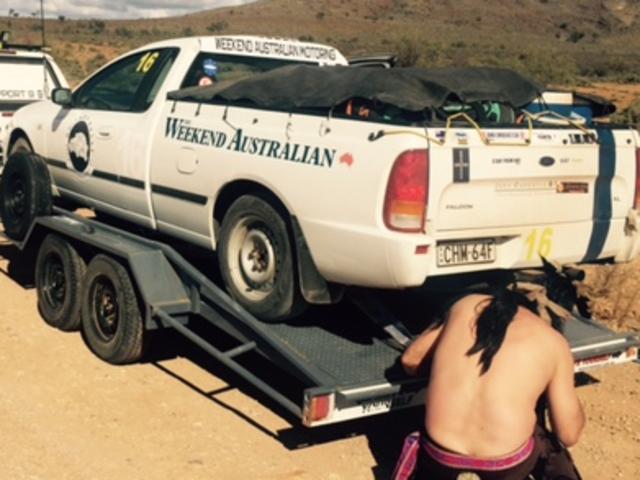 The Weekend Australian's ute, with a broken sump, is loaded on a trailer for the return to Adelaide. It has withdrawn from the Shitbox Rally.