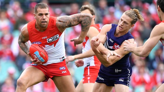 Lance Franklin fends off Nat Fyfe.