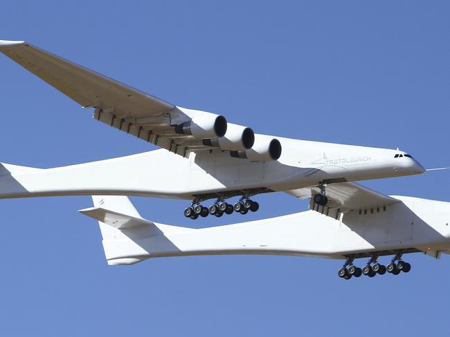 Stratolaunch, a giant six-engine aircraft with the worldâ€™s longest wingspan , makes its historic first flight from the Mojave Air and Space Port in Mojave, Calif., Saturday, April 13, 2019. Founded by the late billionaire Paul G. Allen, Stratolaunch is vying to be a contender in the market for air-launching small satellites.  (AP Photo/Matt Hartman)