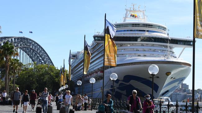 Cruise ship passengers disembark from the Ruby Princess at Circular Quay in Sydney on Thursday. Picture: AAP/DEAN LEWINS