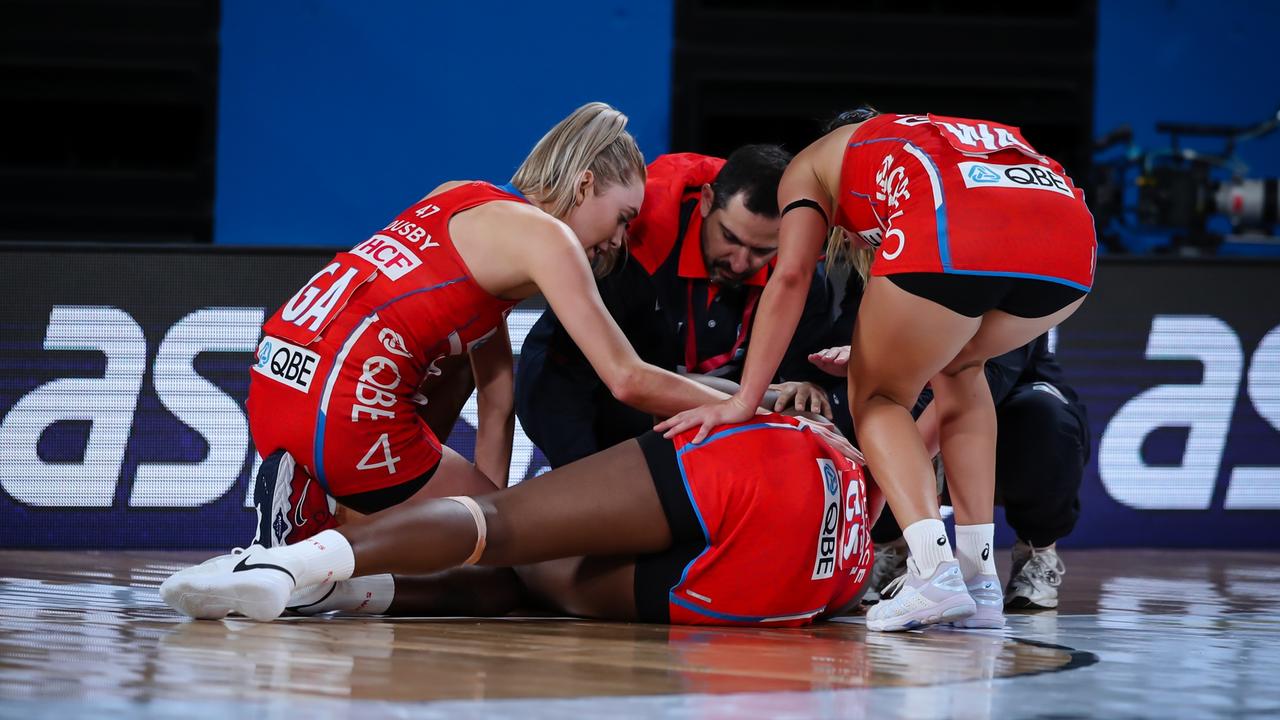 No one likes to see a player go down with a nasty injury. Photo: Narelle Spangher, Netball NSW