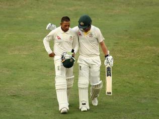 Usman Khawaja and Travis Head after their courageous fightback. 