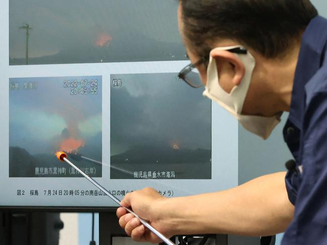 The chief of Japan meteorological agency volcano monitoring division, explains the eruption of Sakurajima. Picture: AFP