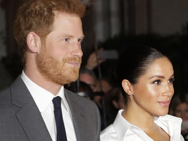 FILE - In this Thursday, Feb. 7, 2019 file photo, Britain's Prince Harry and Meghan, Duchess of Sussex arrive at the annual Endeavour Fund Awards in London. The child of Meghan Markle and Prince Harry will be seventh in the line of succession to the British throne, and also could be an American. The baby expected to arrive in the next few weeks would be the first citizen of Britains former colonies born into the upper echelons of the royal family. (AP Photo/Kirsty Wigglesworth, File)