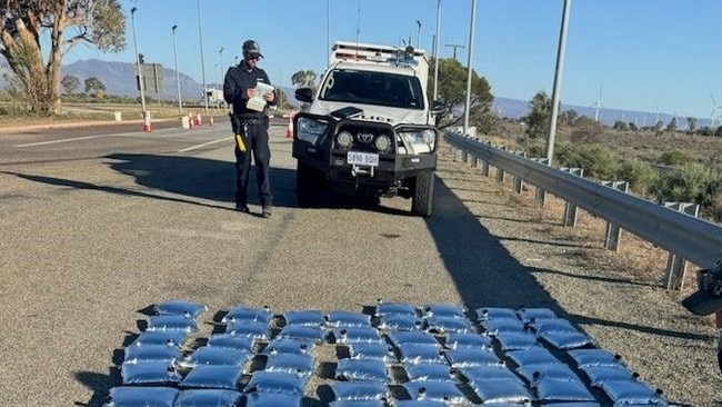 A police officer examines the haul. Picture: SA Police