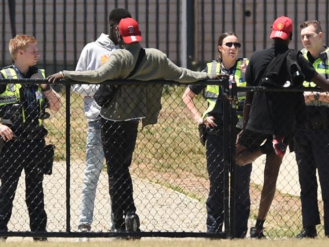 Police speak to African youths outside the Ecoville Community Park in Tarneit.