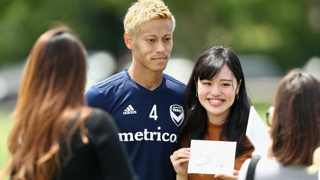 Honda poses with fans after Victory training. Pic: Getty Images