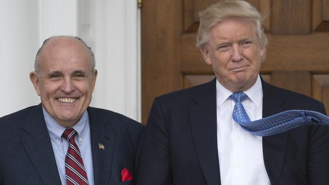 Mr Giuliani and Mr Trump outside the clubhouse of the Trump National Golf Club in Bedminster, New Jersey in 2016. Picture: AFP/Don Emmert