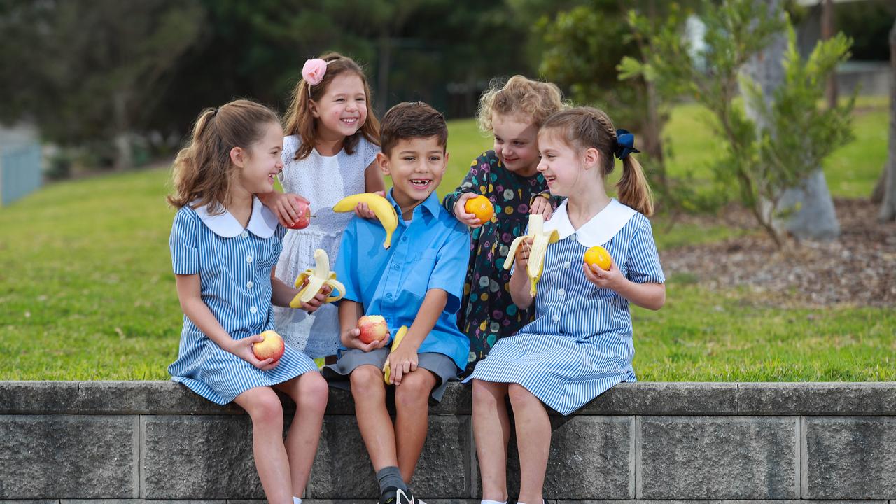 Rachael Huggins, 7, Chloe Huggins, 4, Lucas Costa Sigmond, 6, Lily Withey, 3, and Elizabeth Weston, 6 celebrate 100 million pieces of free fruit given to kids since 2015. Picture: Justin Lloyd.