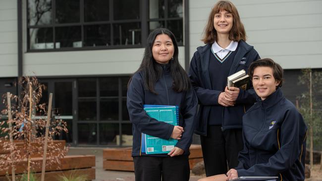 Year 10 students Sarah, Mia and Harvey, all 15, are among those carefully choosing their VCE subjects. Picture: Jason Edwards