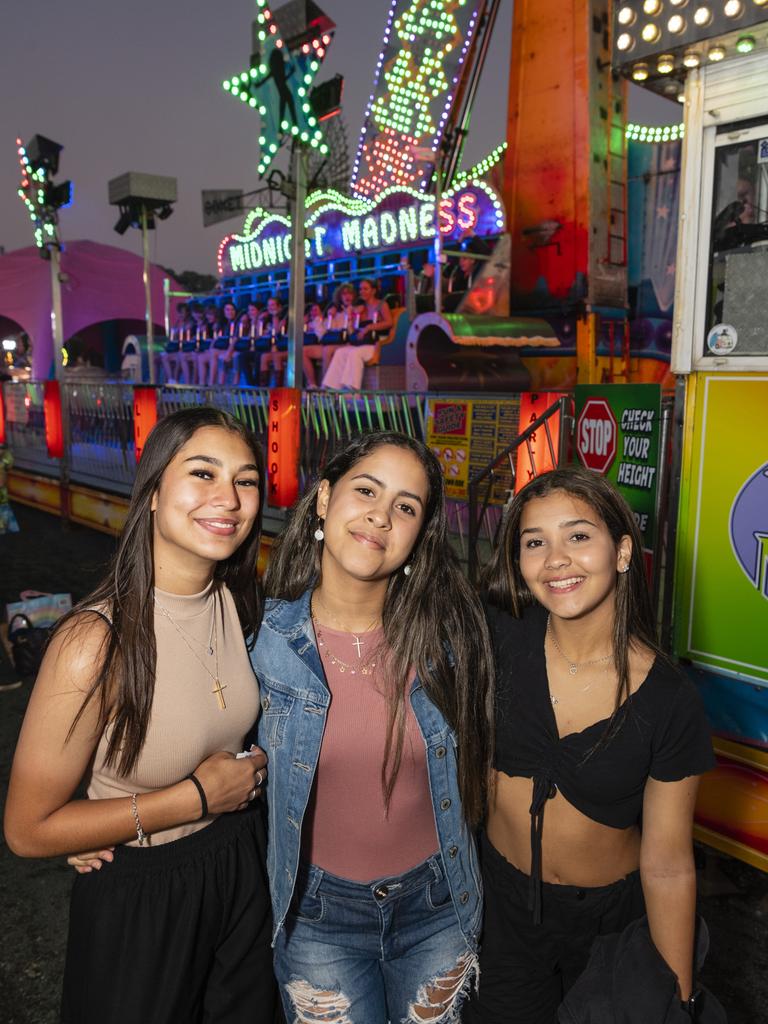 Ready to ride the Midnight Madness show ride are (from left) Heloisa Da Silva, Giovana Alves and Marianna De Paula at the Toowoomba Royal Show, Thursday, March 30, 2023. Picture: Kevin Farmer