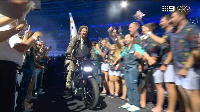 He then rode out of the stadium on a motorbike. Picture: Channel 9