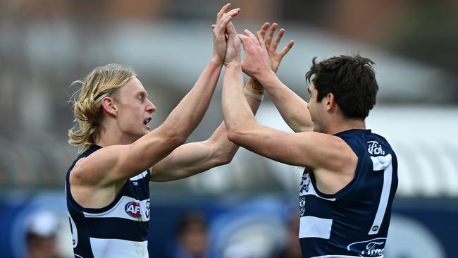 Dempsey celebrates a goal with Shaun Mannagh against North Melbourne. Picture: Steve Bell/Getty Images.