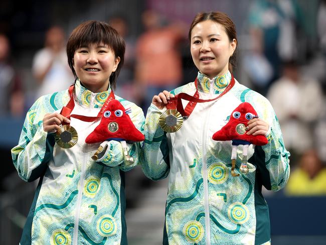 PARIS, FRANCE - AUGUST 31: Gold medalists Li Na Lei (R) and Qian Yang (L) of Team Australia pose on the podium at the Para Table Tennis Women's Doubles - WD20 Medal Ceremony on day three of the Paris 2024 Summer Paralympic Games at South Paris Arena on August 31, 2024 in Paris, France. (Photo by Michael Reaves/Getty Images)