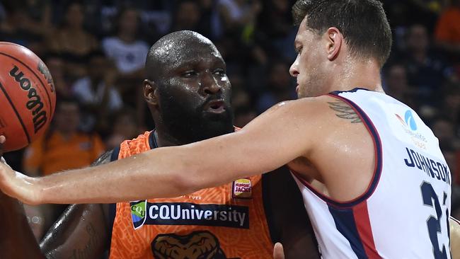 Nate Jawai of the Taipans looks to pass the ball past Daniel Johnson of the 36ers during the round 16 NBL match between the Cairns Taipans and the Adelaide 36ers at Cairns Convention Centre on February 02, 2019 in Cairns, Australia. (Photo by Ian Hitchcock/Getty Images)