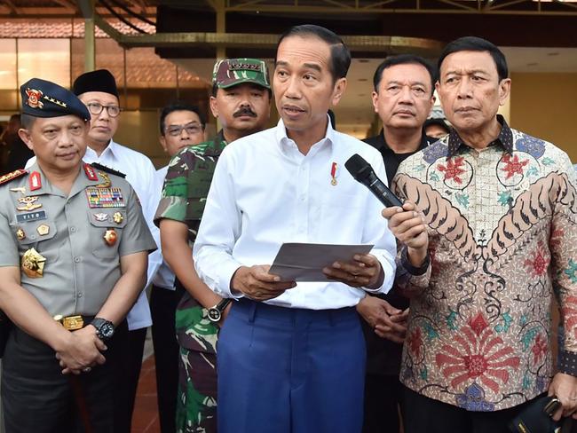 Indonesian President Joko Widodo and other officials holding a press conference in Surabaya after Sunday’s suicide bombings. Picture: AFP