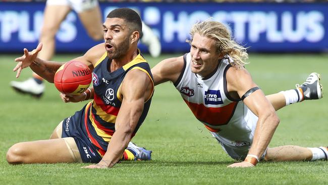 Adelaide Crows’ Curtly Hampton battles against GWS Giants’ Nick Haynes. Picture: SARAH REED