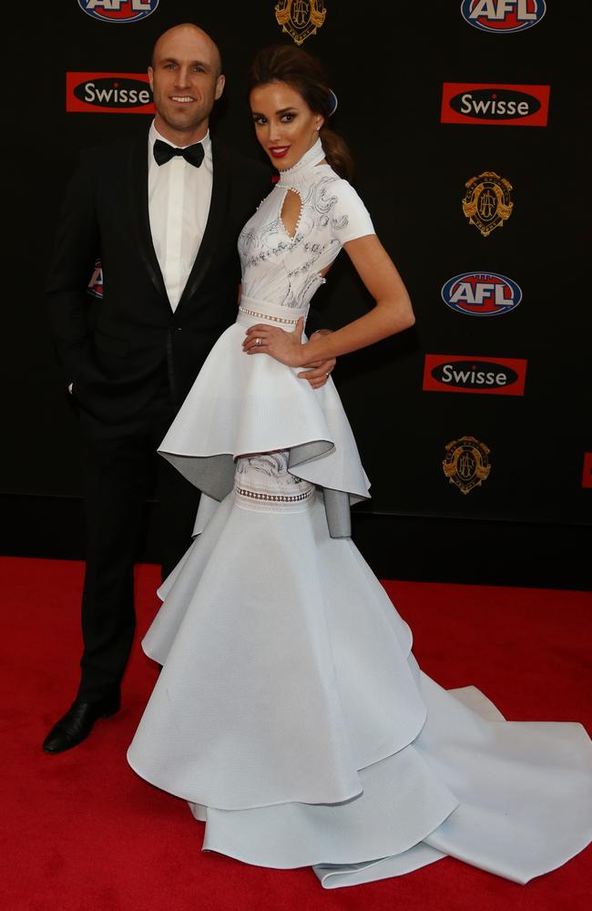 Chris and Rebecca Judd on the red carpet during the arrivals for the 2014 AFL Brownlow Medal at Crown Casino