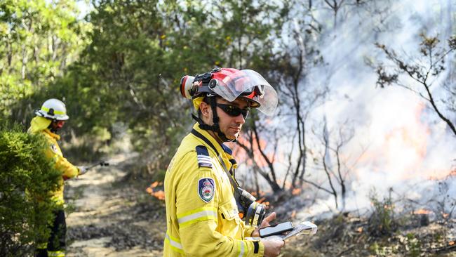 NSW FRS captain Theo Klich organises the Canoelands backburn today. Picture: Darren Leigh Roberts