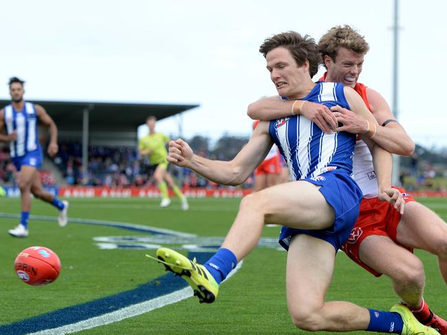 HOBART, AUSTRALIA - MARCH 09: Jared Polec of the kangaroos is tackled by Nick Blakey of the swans during the 2020 Marsh Community Series AFL match between the North Melbourne Kangaroos and the Sydney Swans at Kingston Town Oval on March 09, 2020 in Hobart, Australia. (Photo by Steve Bell/Getty Images)